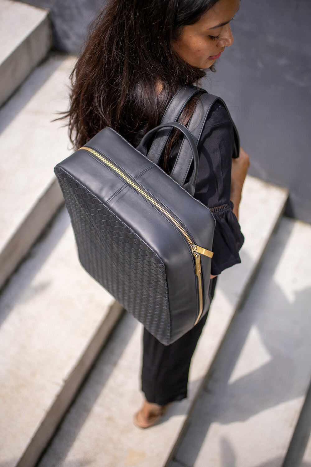 Luxurious hand woven leather structured backpack in black staiy